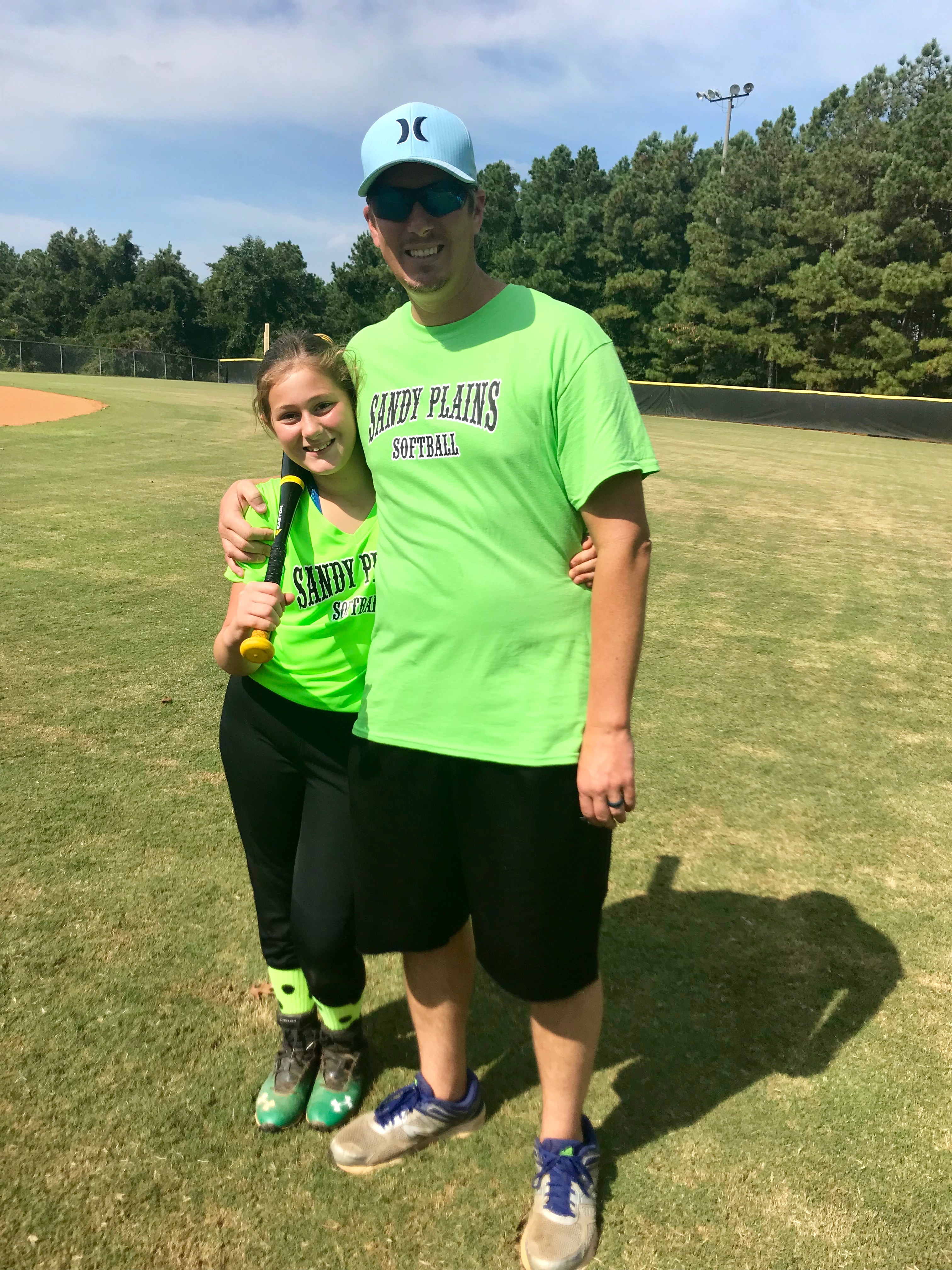 Father and daughter at the softball field
