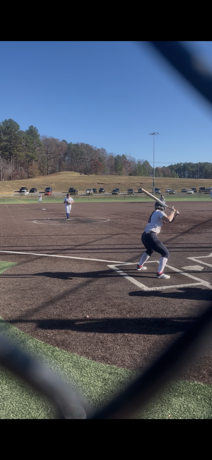 Travel softball player at the plate